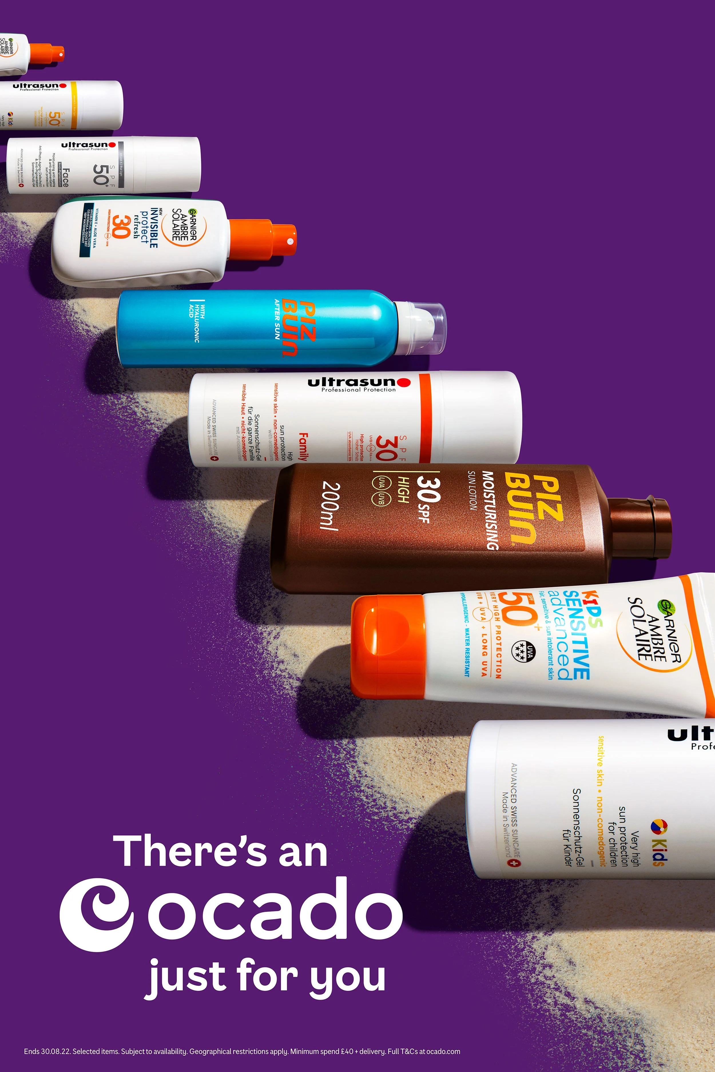 Assorted sunscreen bottles arranged on a purple background with Ocado promotional text, “There’s an Ocado just for you.”