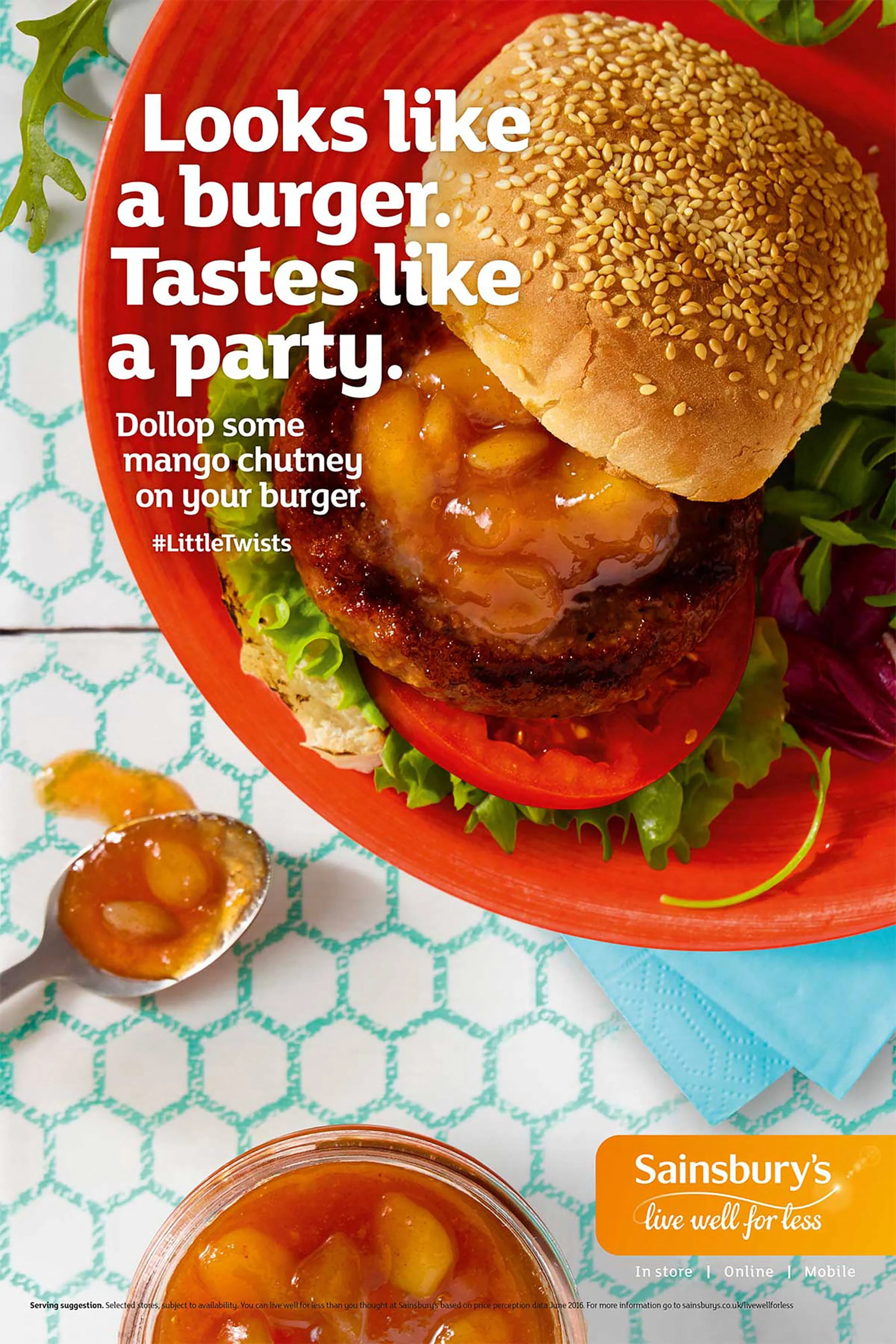 Sesame seed burger topped with mango chutney, lettuce, and tomato on a red plate, with Sainsbury’s promotional text.