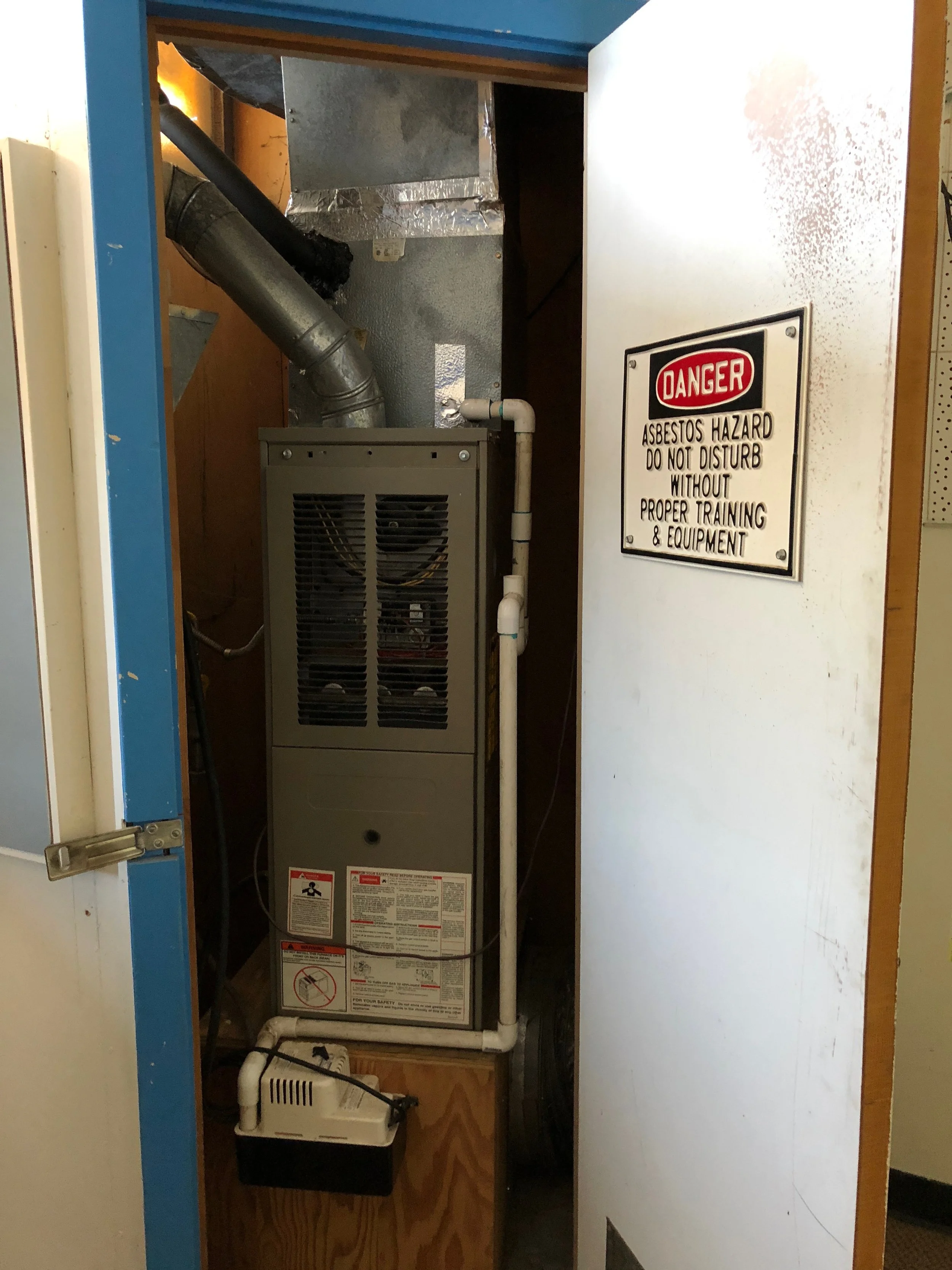 Furnace with Asbestos Hazard sign