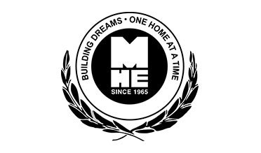 Black-and-white circular Home Essentials logo with laurel branches and the slogan “Building Dreams • One Home at a Time”