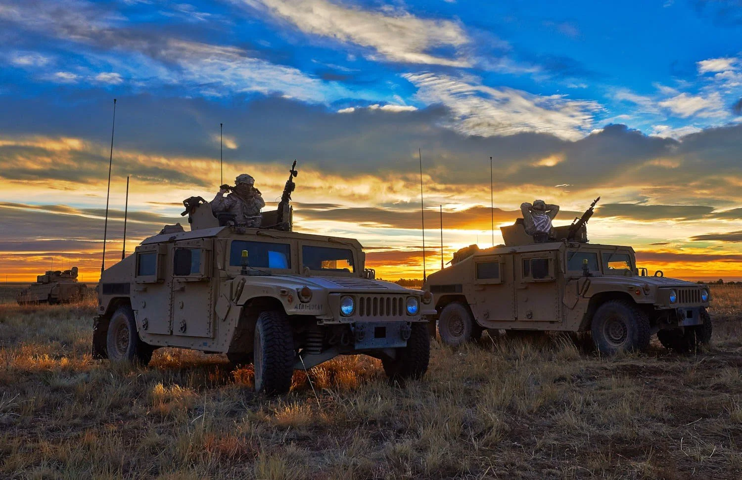 Military. Humvees at sunrise.