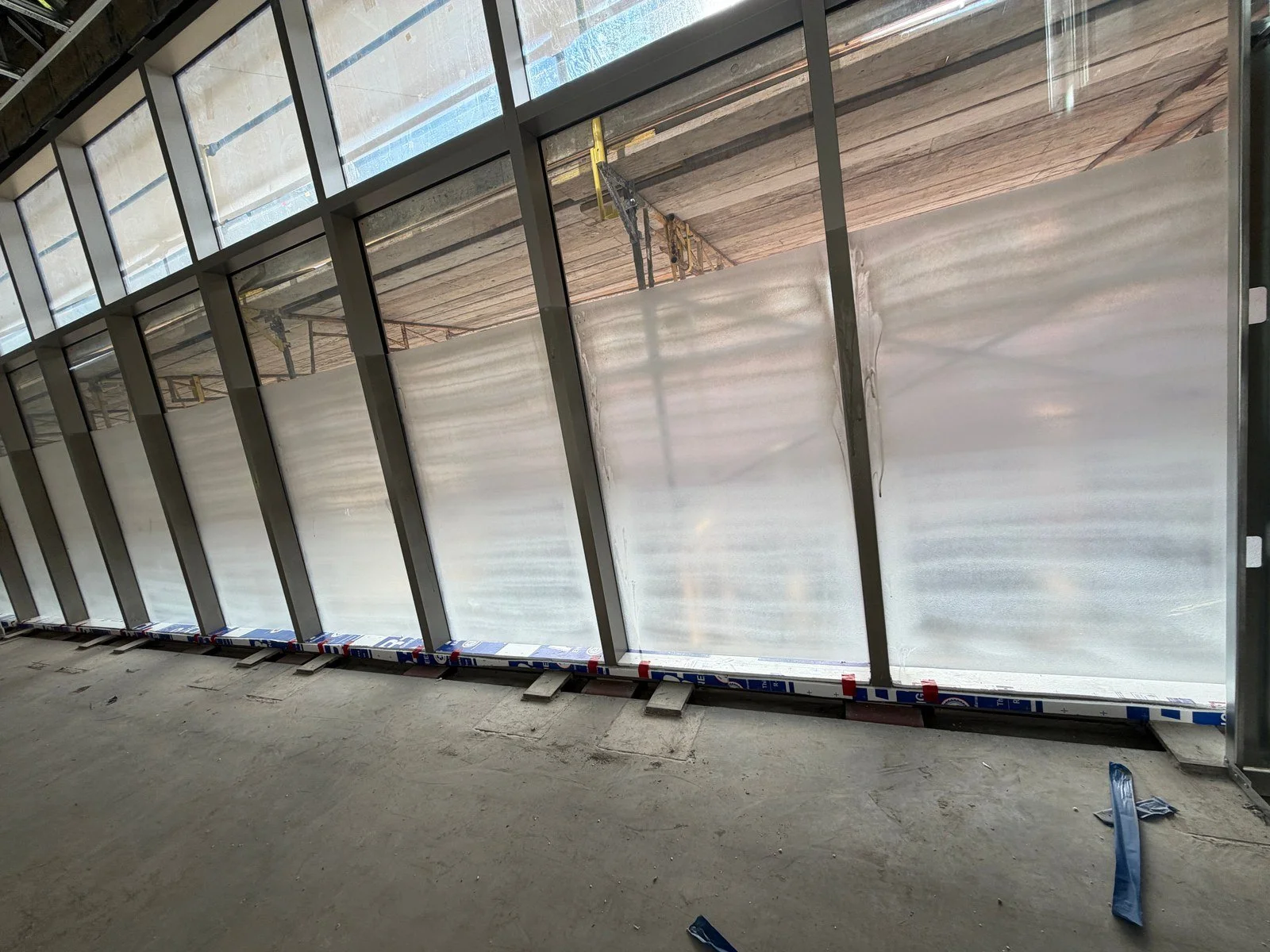A long run of Protectapeel-coated window wall at the USC Football Performance Center during construction.
