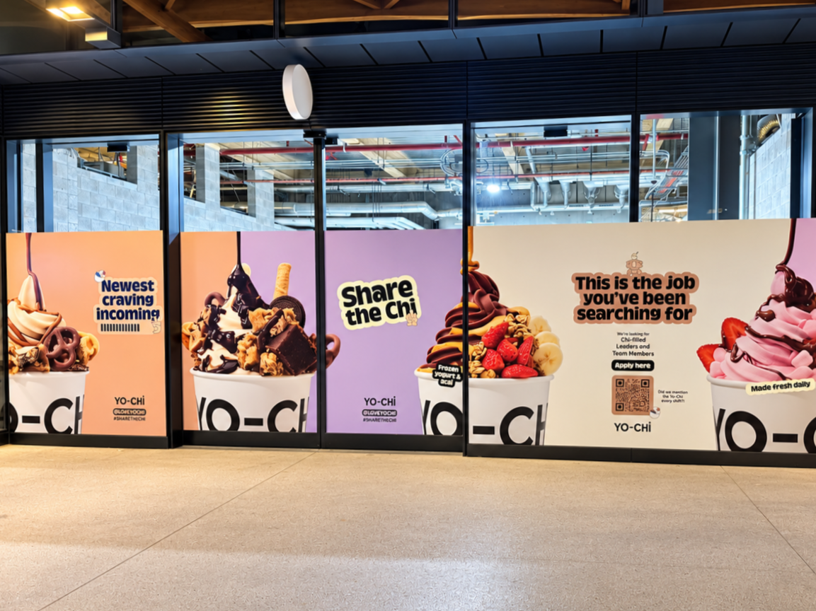 Decorative wall advertisements for frozen yogurt with various toppings, featuring phrases like "Newest craving incoming," "Share the Chi," and "This is the job you've been searching for," along with QR codes and branding for YO-CHI.