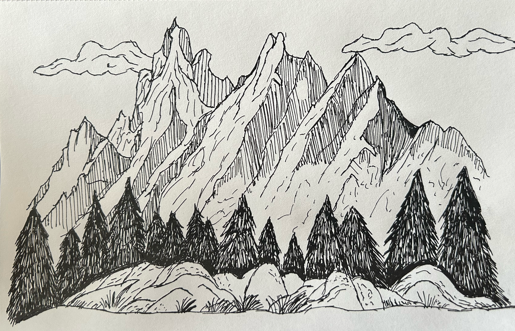 A black and white line drawing of a mountain landscape with jagged peaks, pine trees at the base, and clouds in the sky.