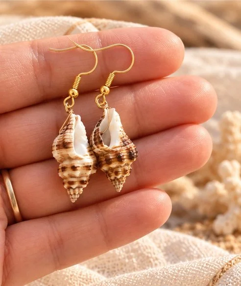 Nalu conch shell earrings gold.jpg