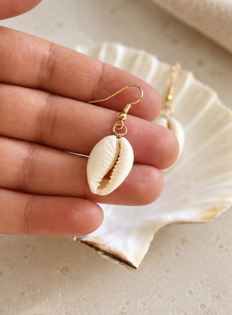 Haumea cowrie shell earrings 2.png