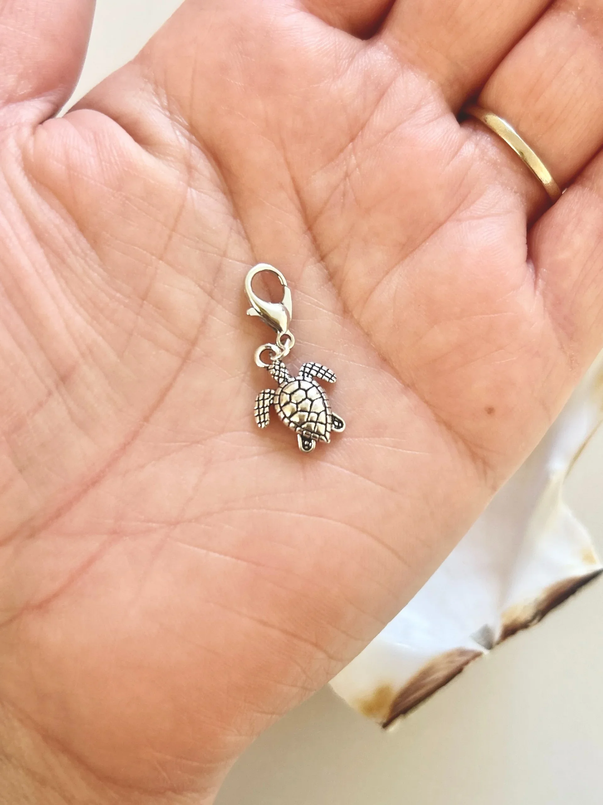 Kaiola silver sea turtle charm.webp