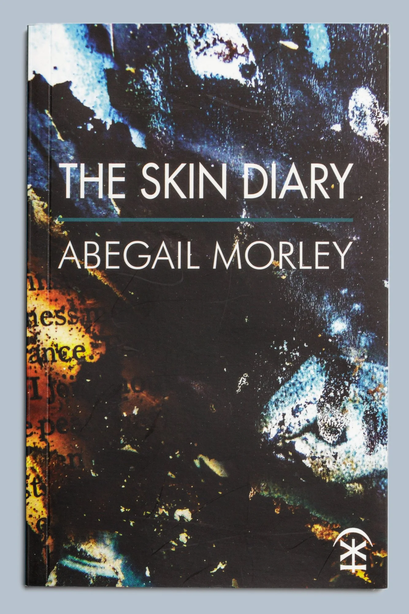 Book cover for “The Skin Diary” by Abigail Morley, featuring an abstract black, blue, white, and orange textured design.
