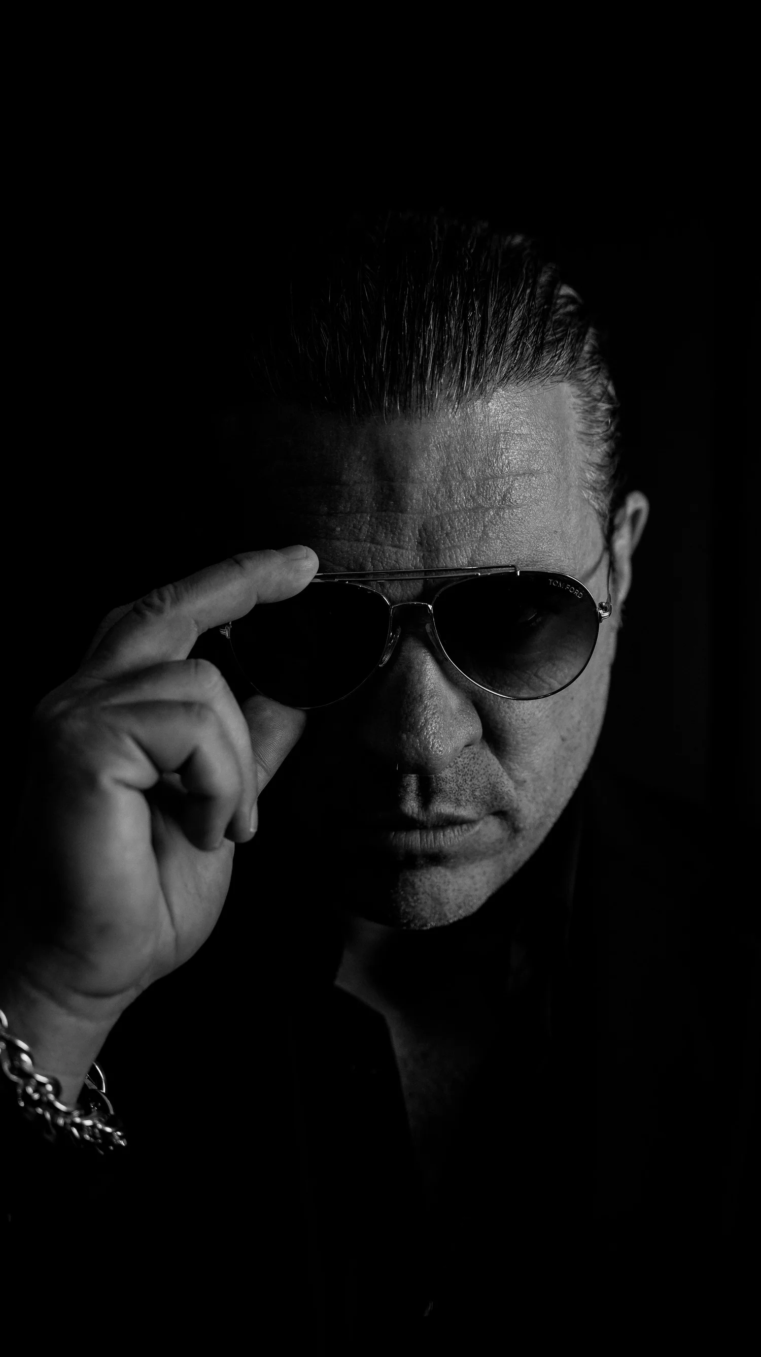 Dr. Christopher Ramsey in sunglasses, black and white portrait