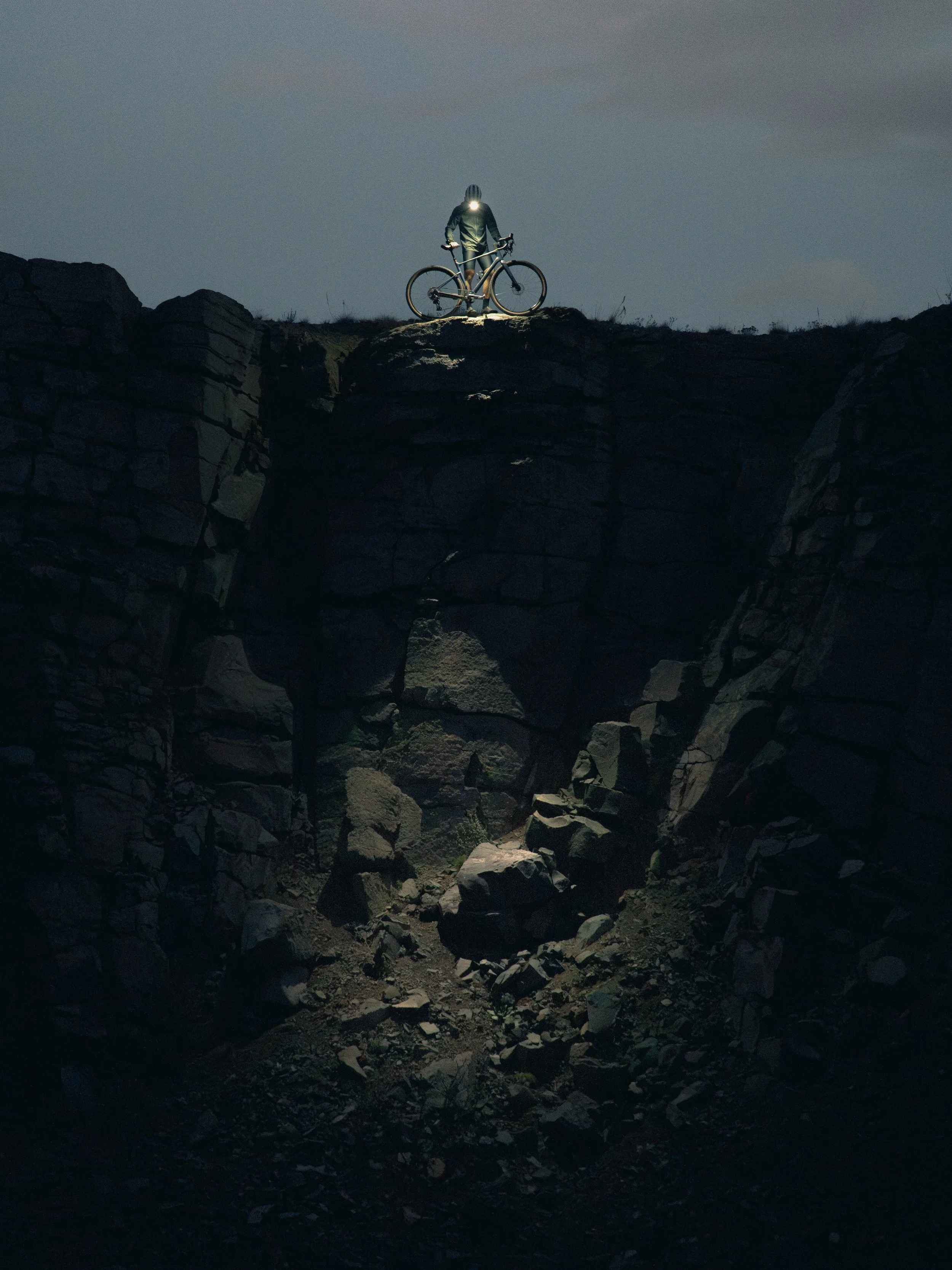 Dark Bike photo looking down a rock face