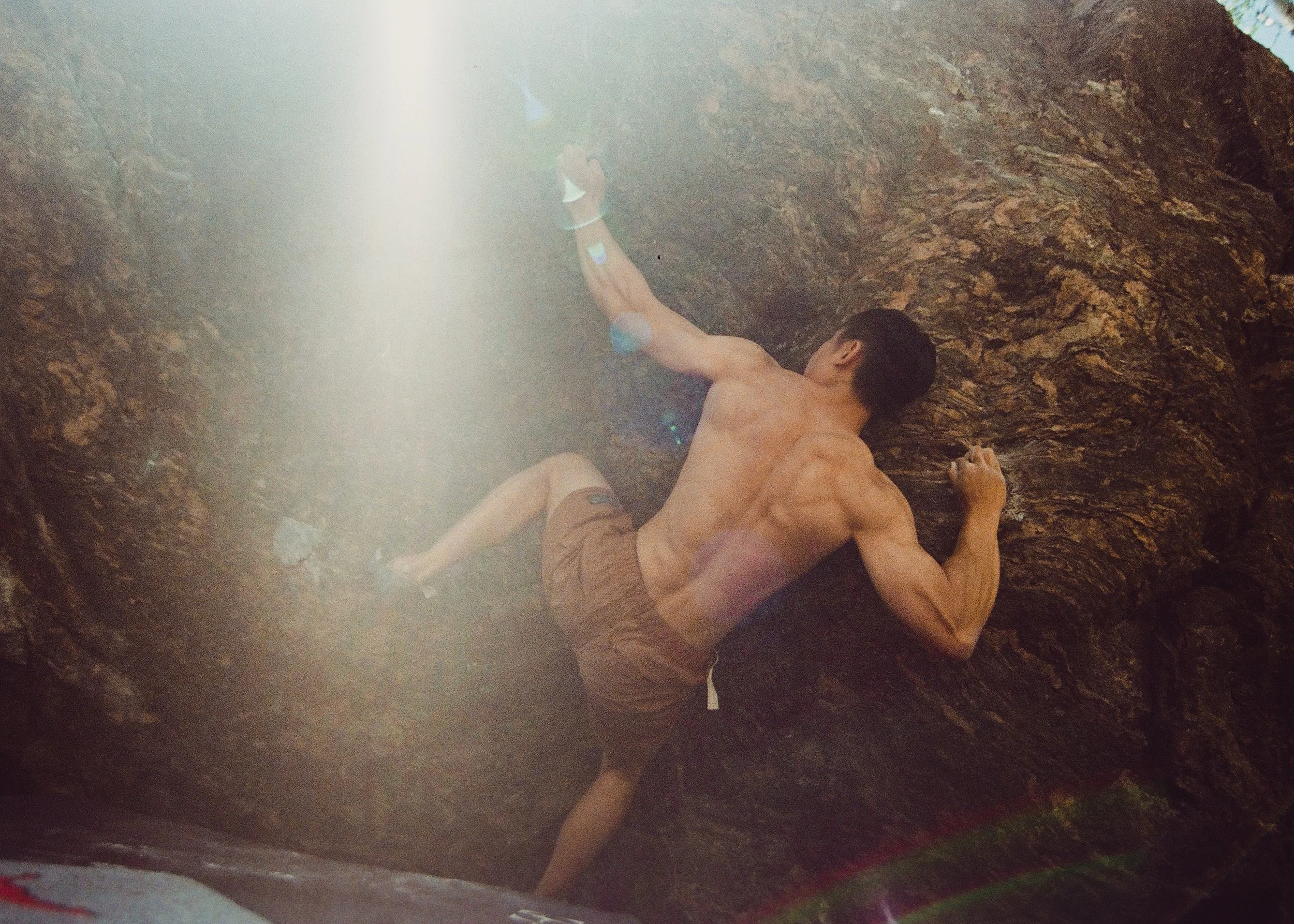 35mm Film Photo of rockclimber making a move with sun blinding