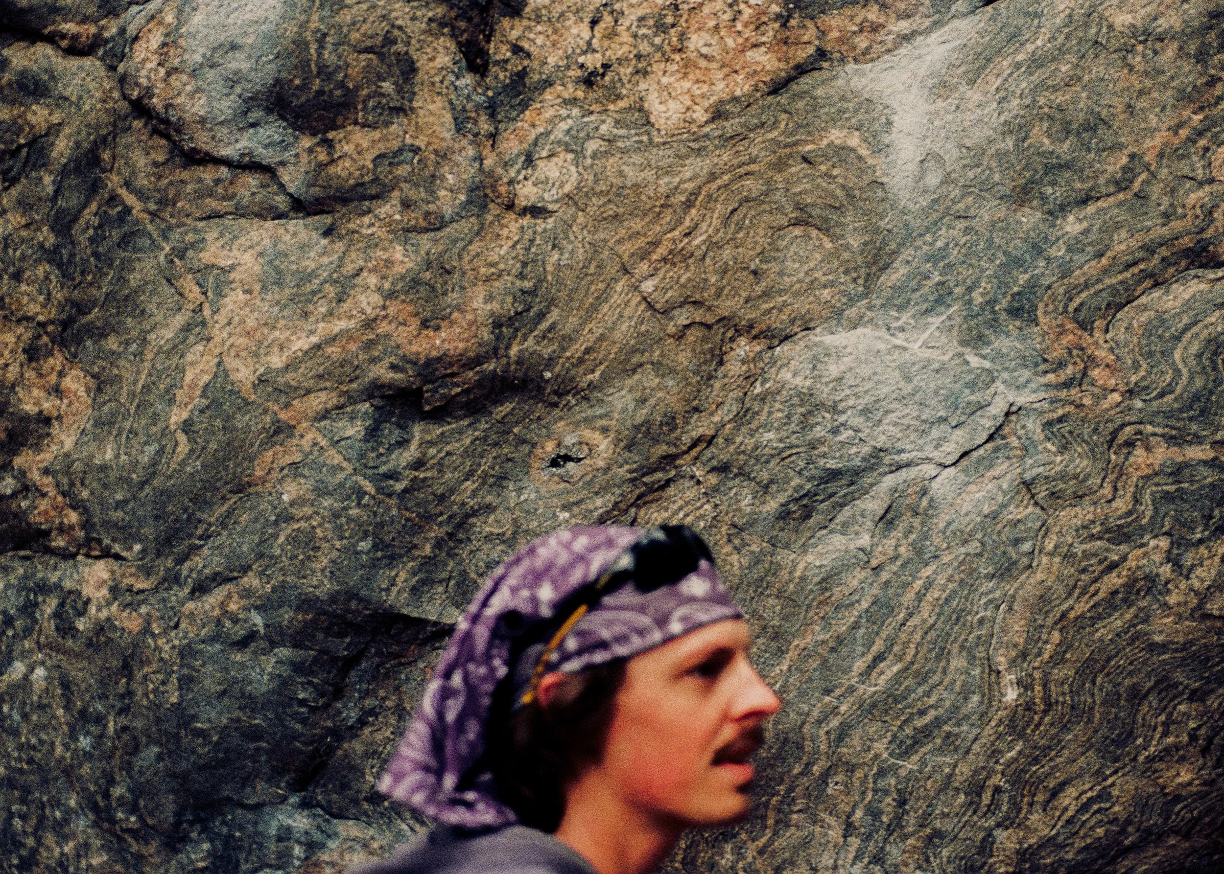 Rock Climber standing in front of rockwall