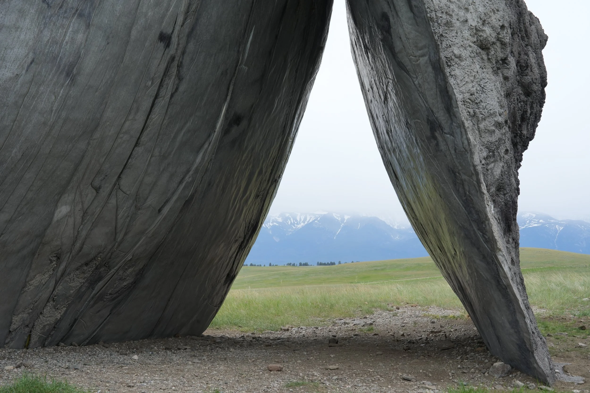 Concrete sculpture in front of the Beartooth Mountains