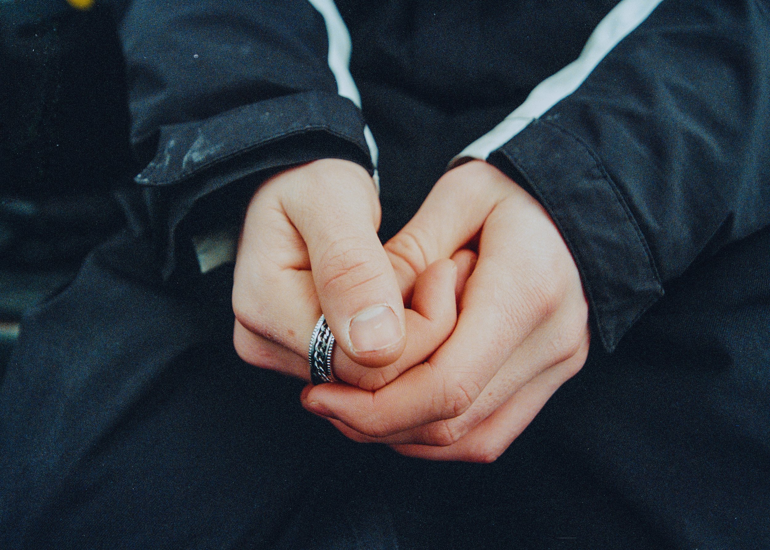 Skiers hands clasping, with ring