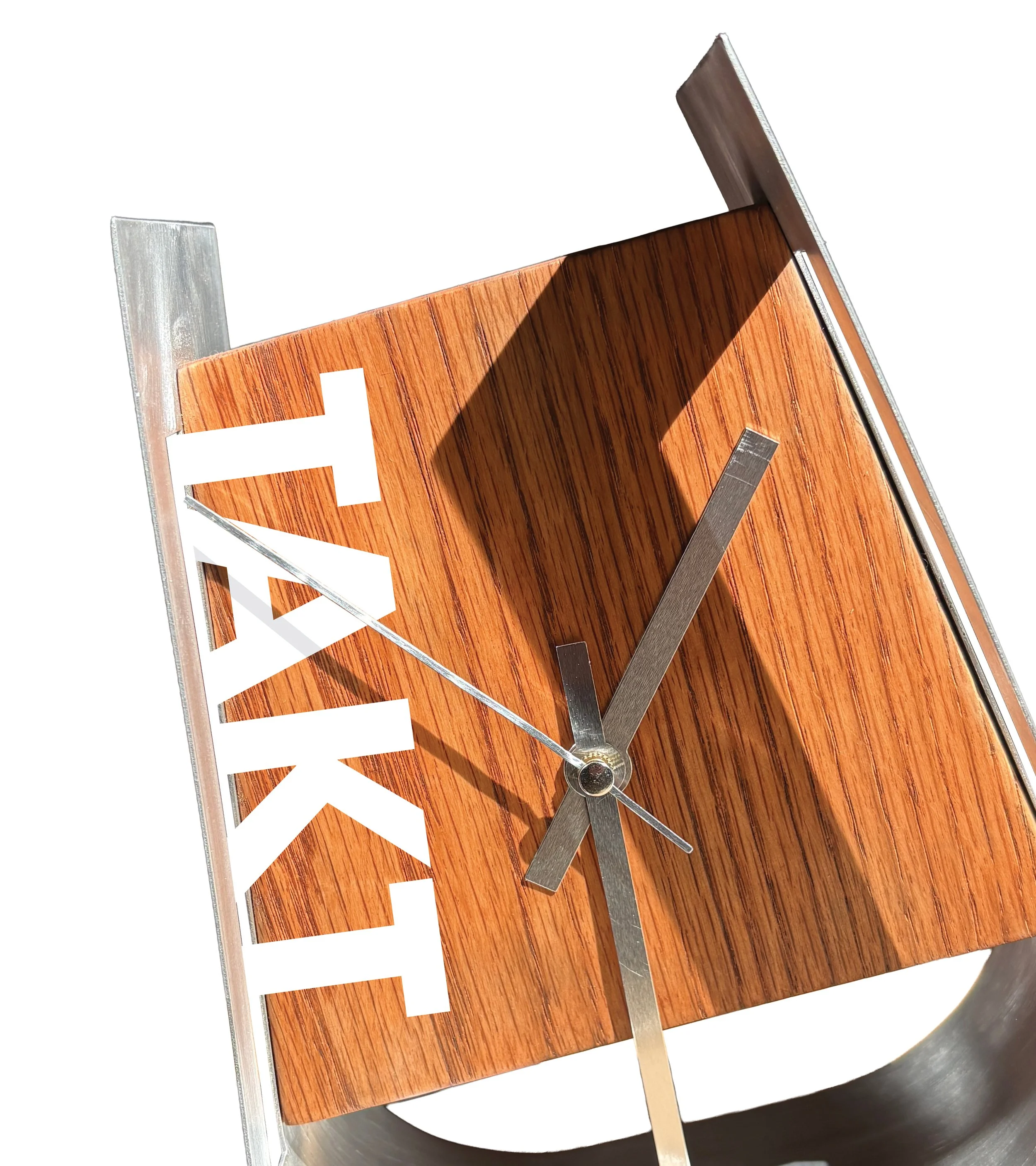 Close-up of a modern clock with a wooden face and metallic frame, showing the time as approximately 9:06.
