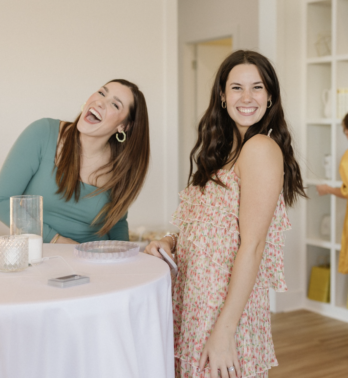 Guests laughing together at The Gulf Coast Mom launch event