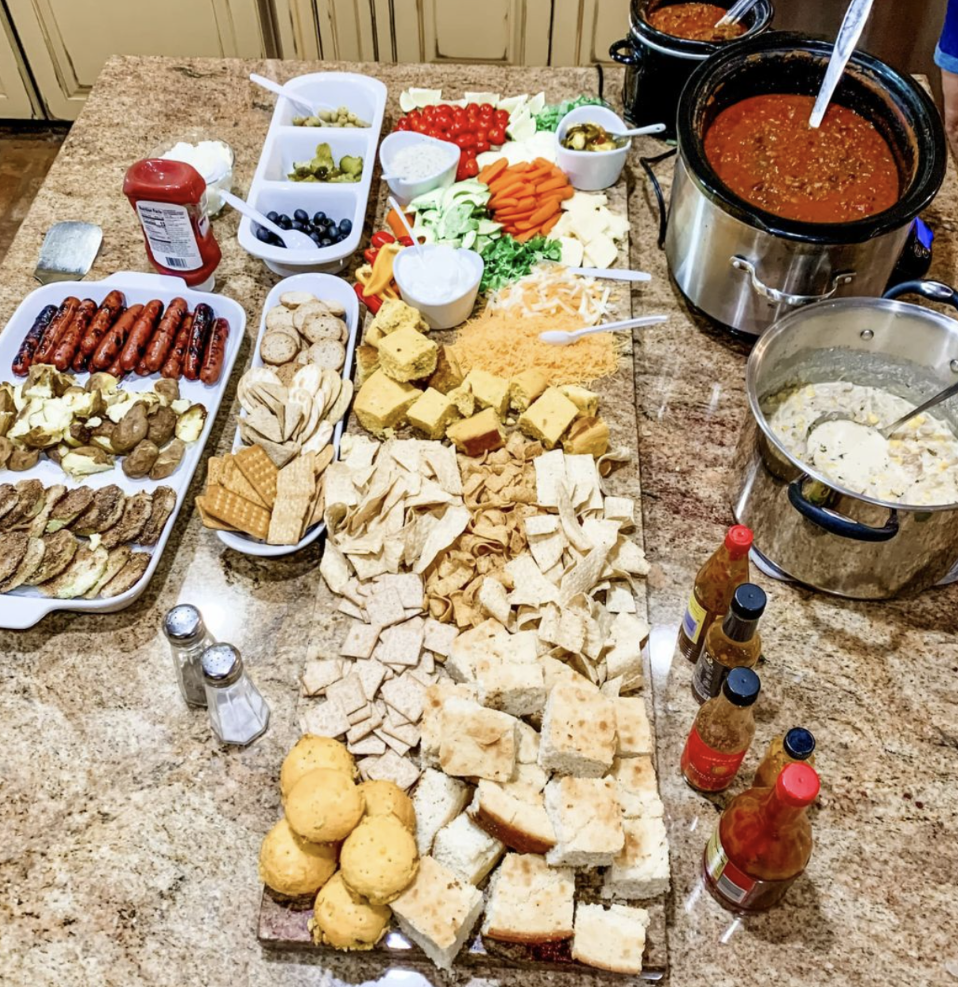 Chili charcuterie board with toppings and crackers