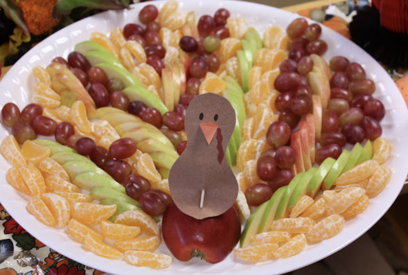 Turkey fruit tray made with apples, grapes and oranges