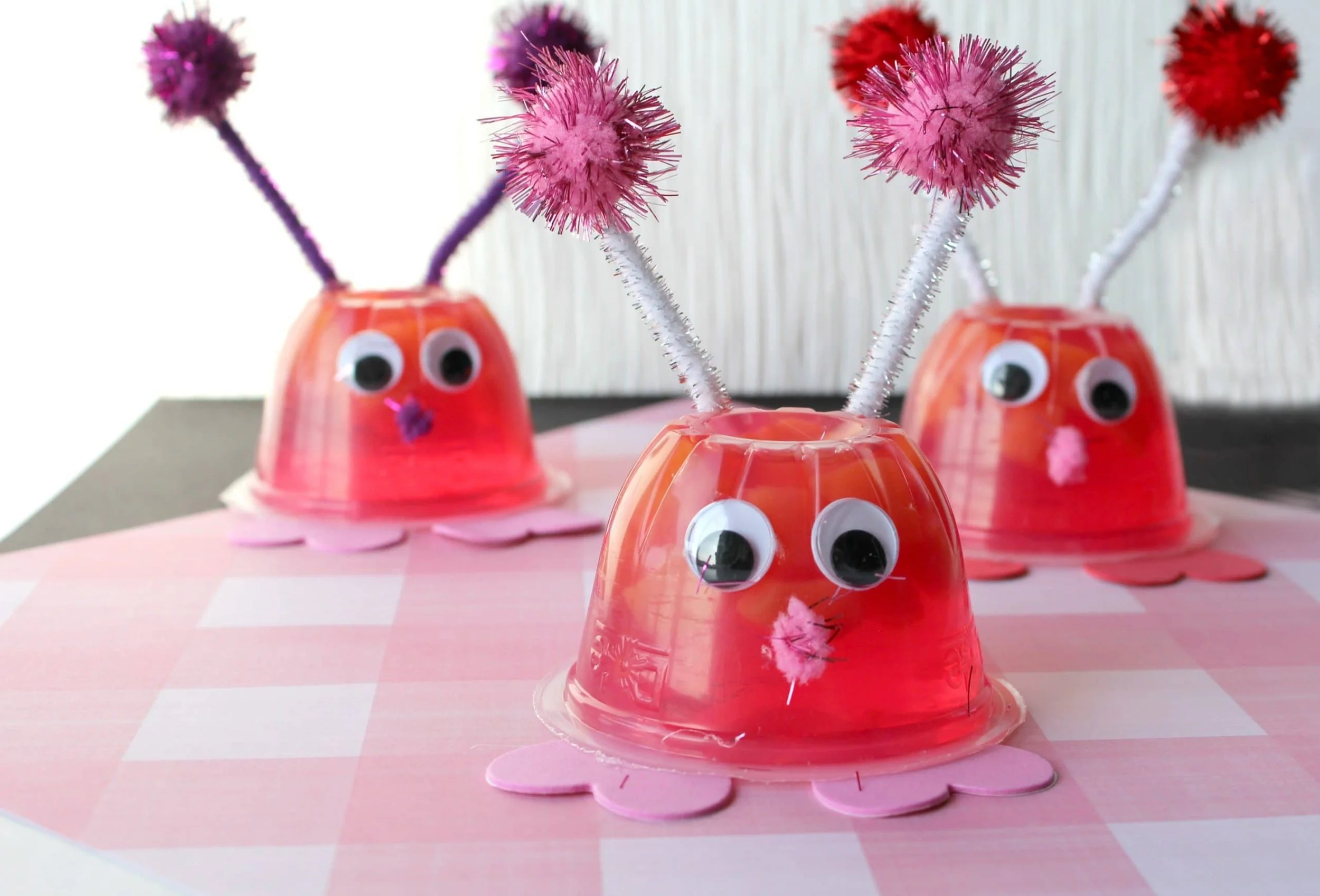 Jello fruit cup love bugs with pipe cleaner antennae