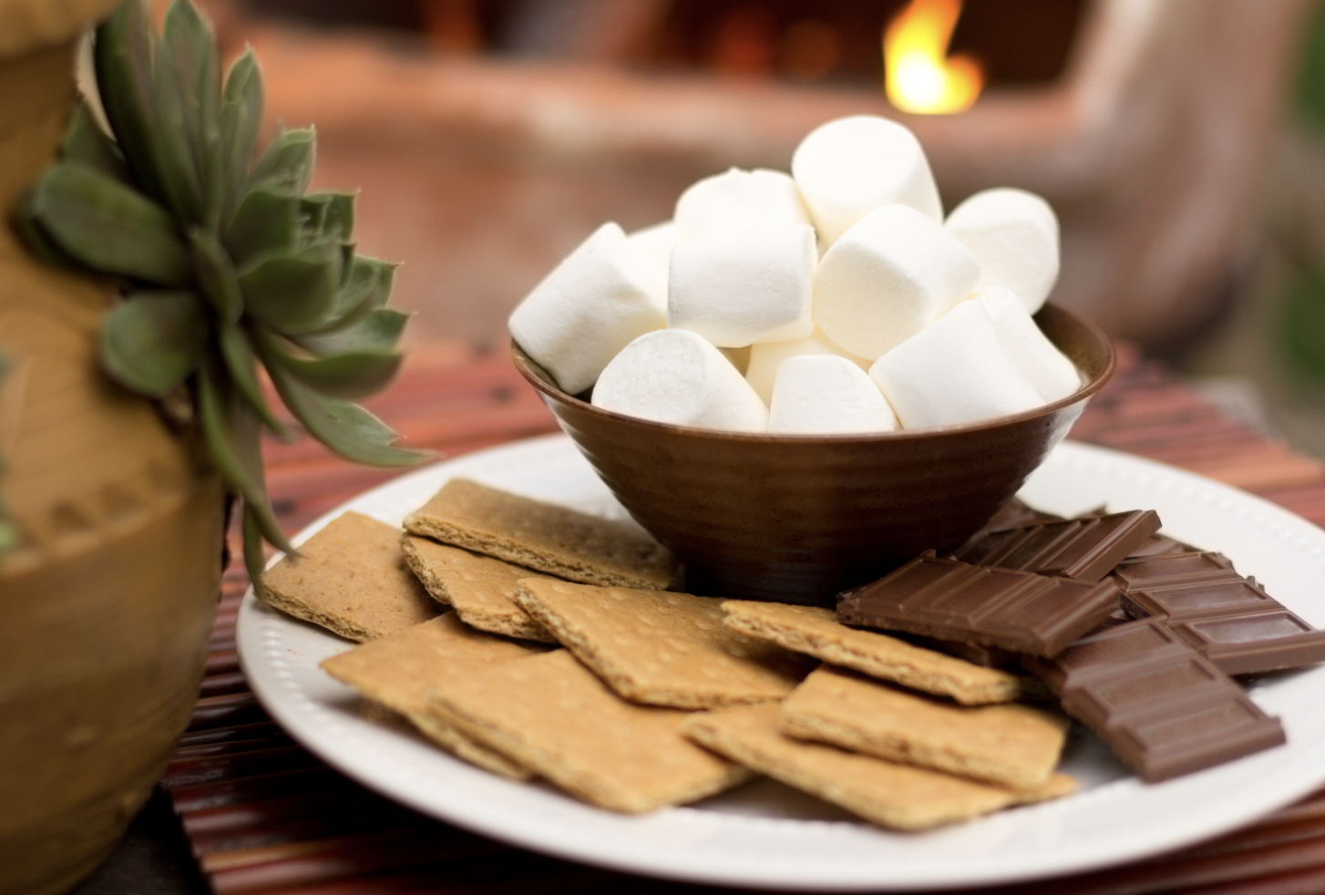 S'mores ingredients with marshmallows, graham crackers and chocolate