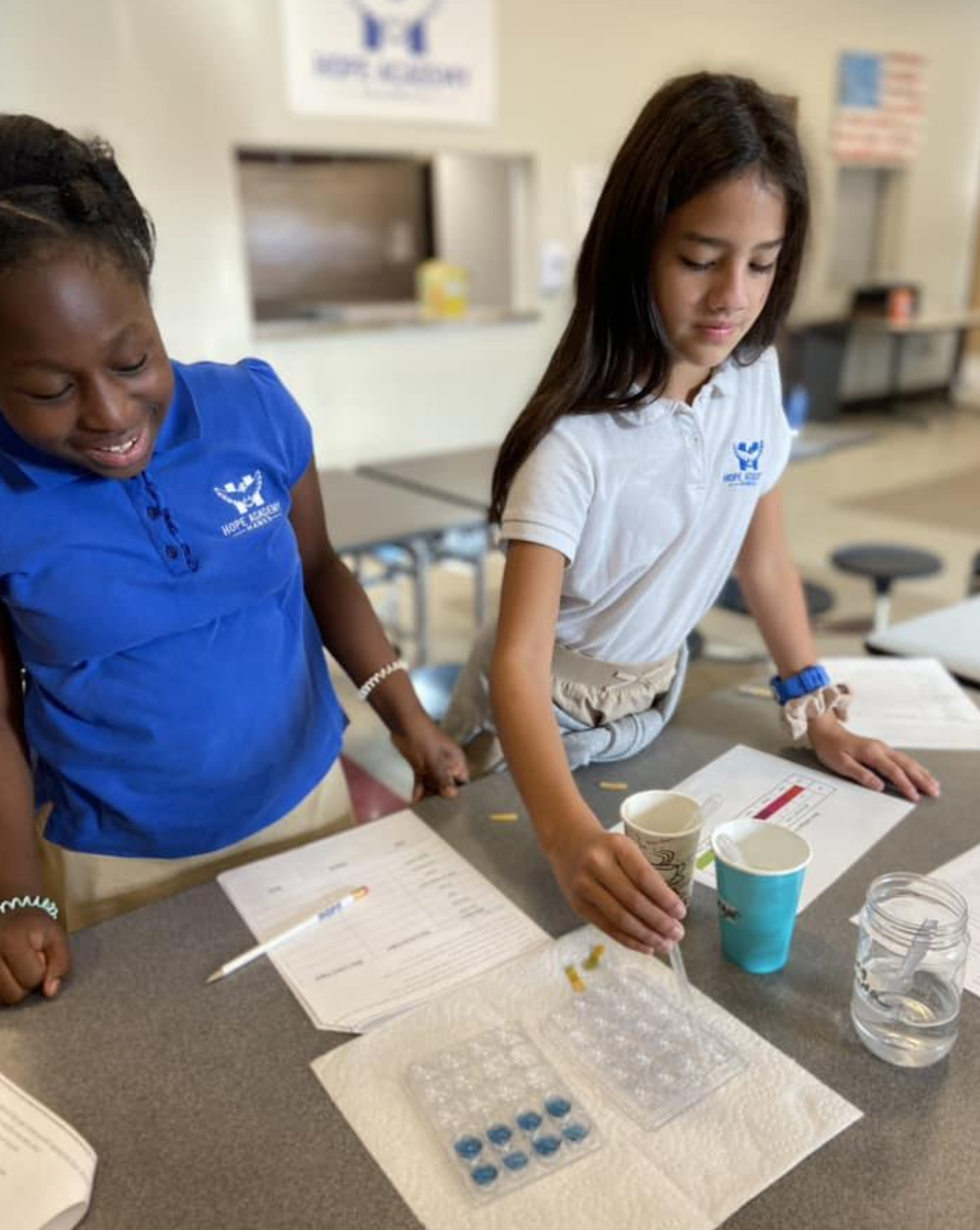 Two students working at a table at Hope Academy