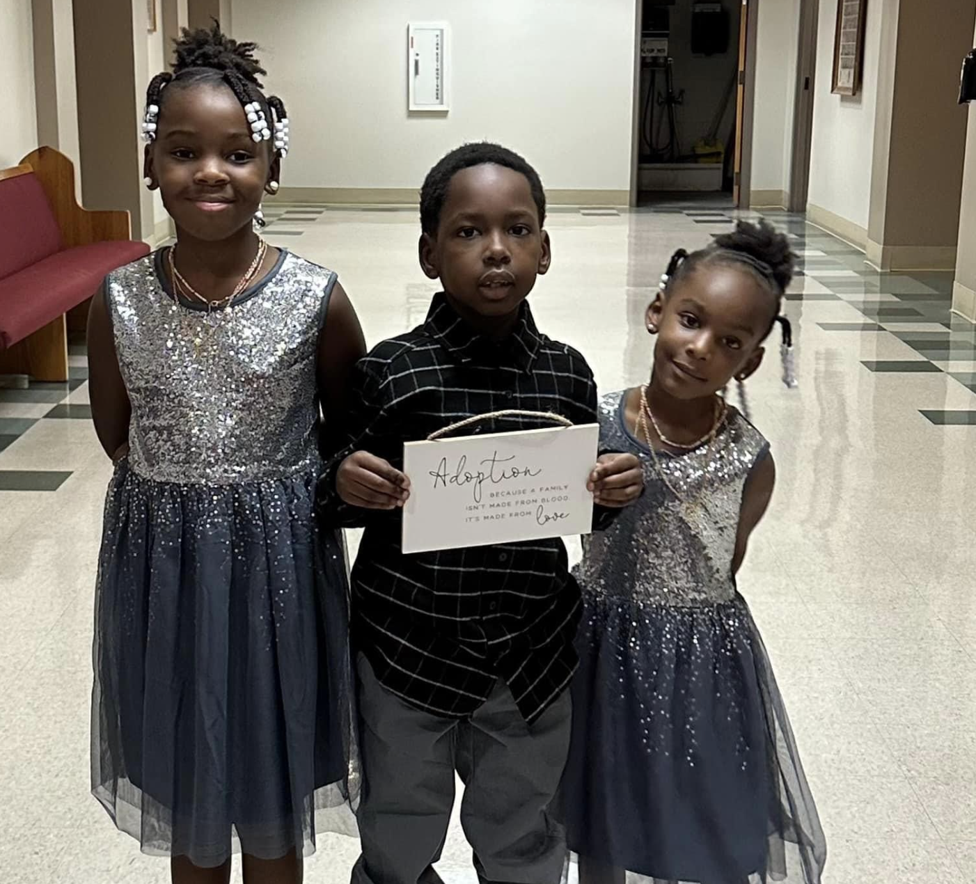 Siblings celebrating adoption day at the courthouse