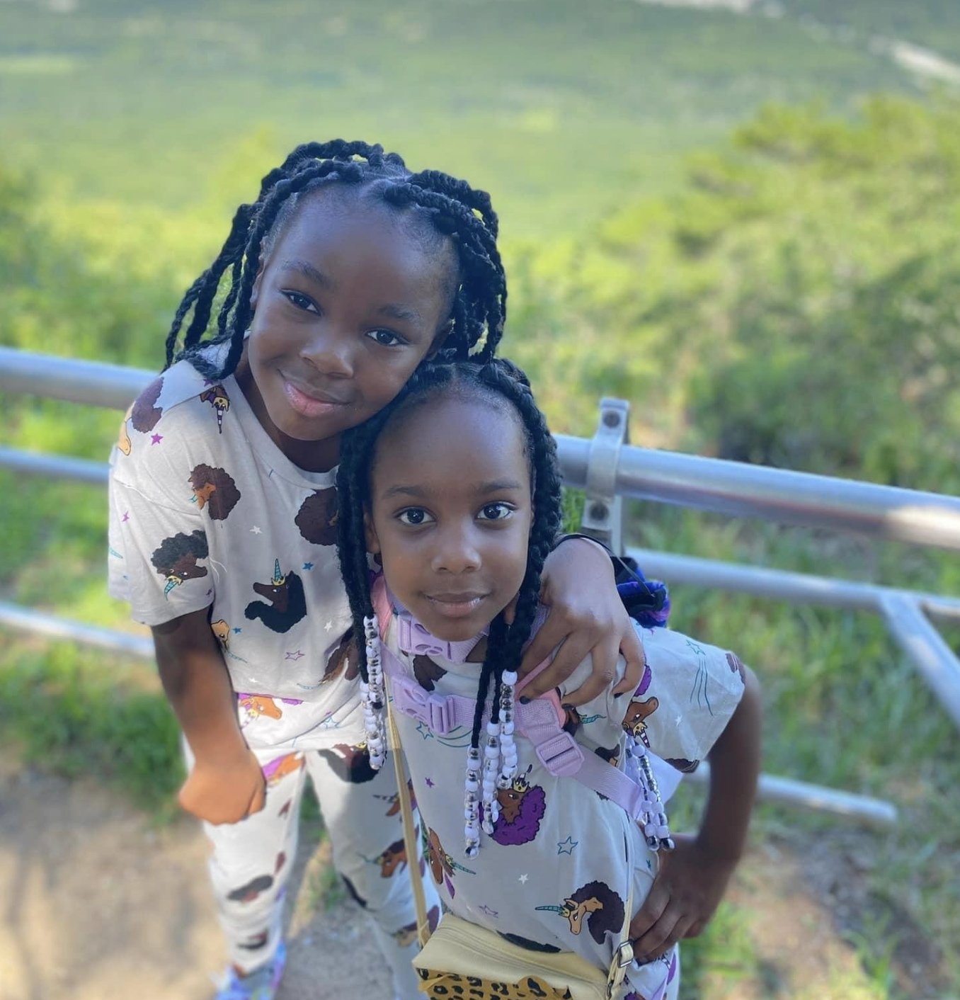 Two sisters smiling outdoors