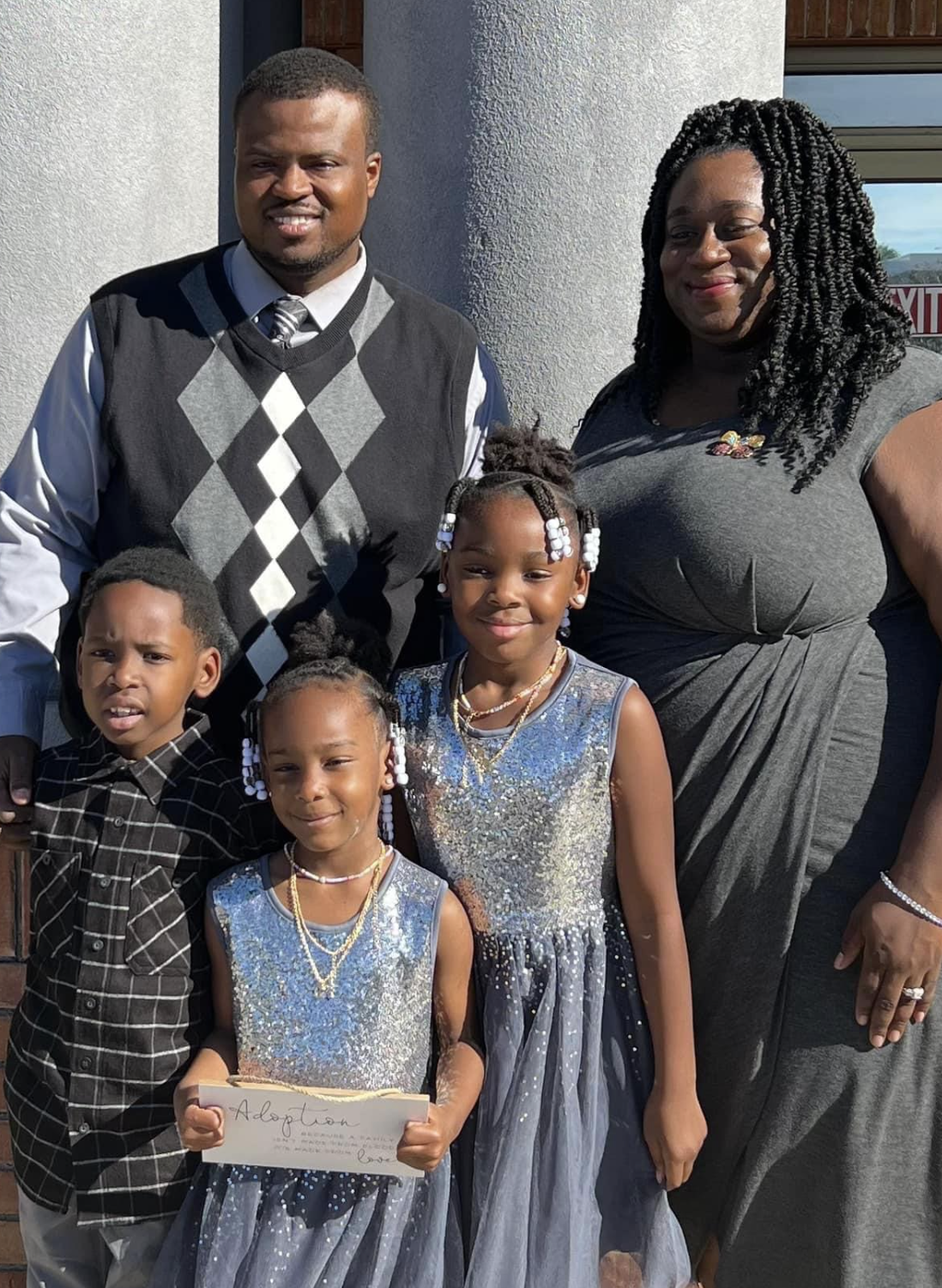 Adoptive family portrait with parents and five children