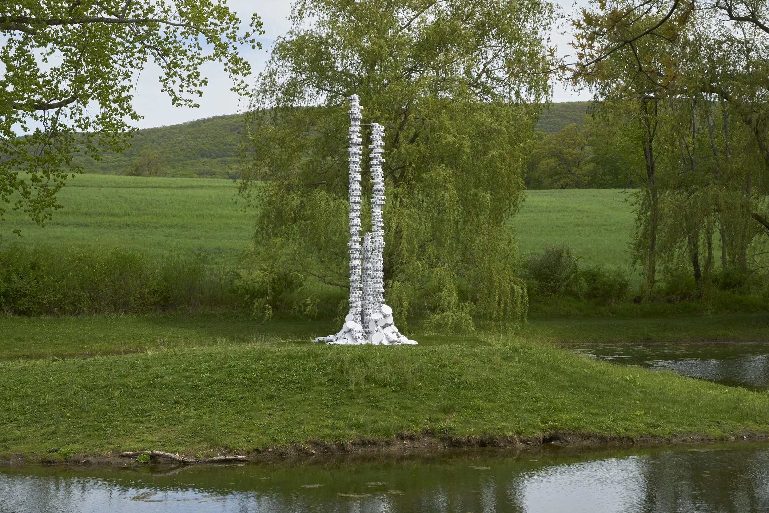  The peo-ple cried mer-cy in the storm , 2018 
Painted tambourines and steel armature 
18 feet x 36 inches x 36 inches