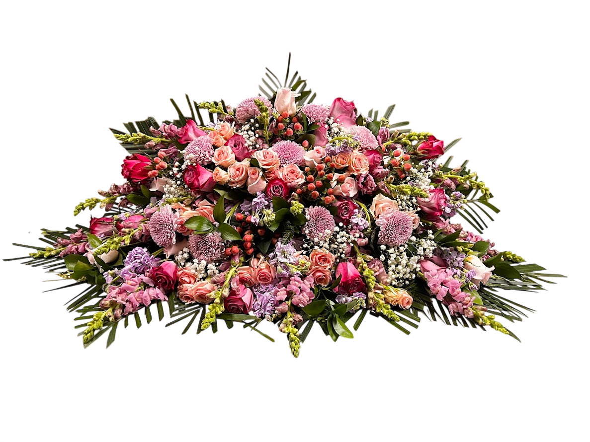Assorted pink and purple casket spray
