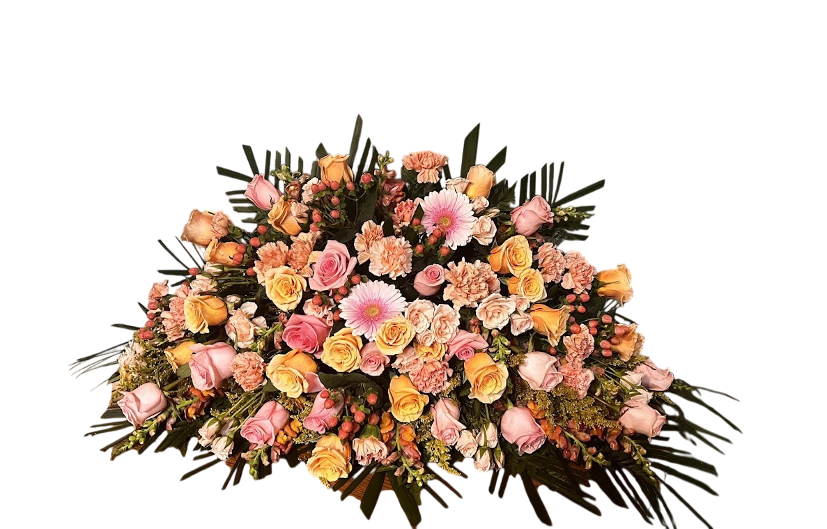 Assorted pink and coral casket spray
