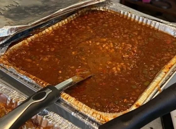 a picture of baked beans in a tray
