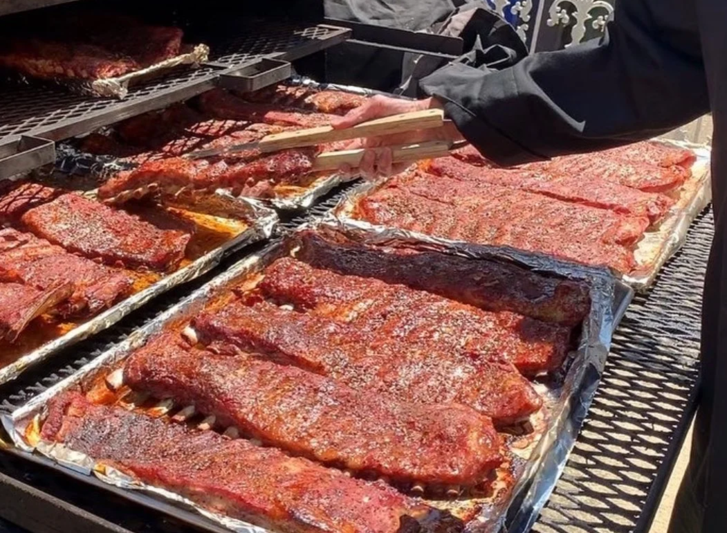 a picture of ribs on a smoker