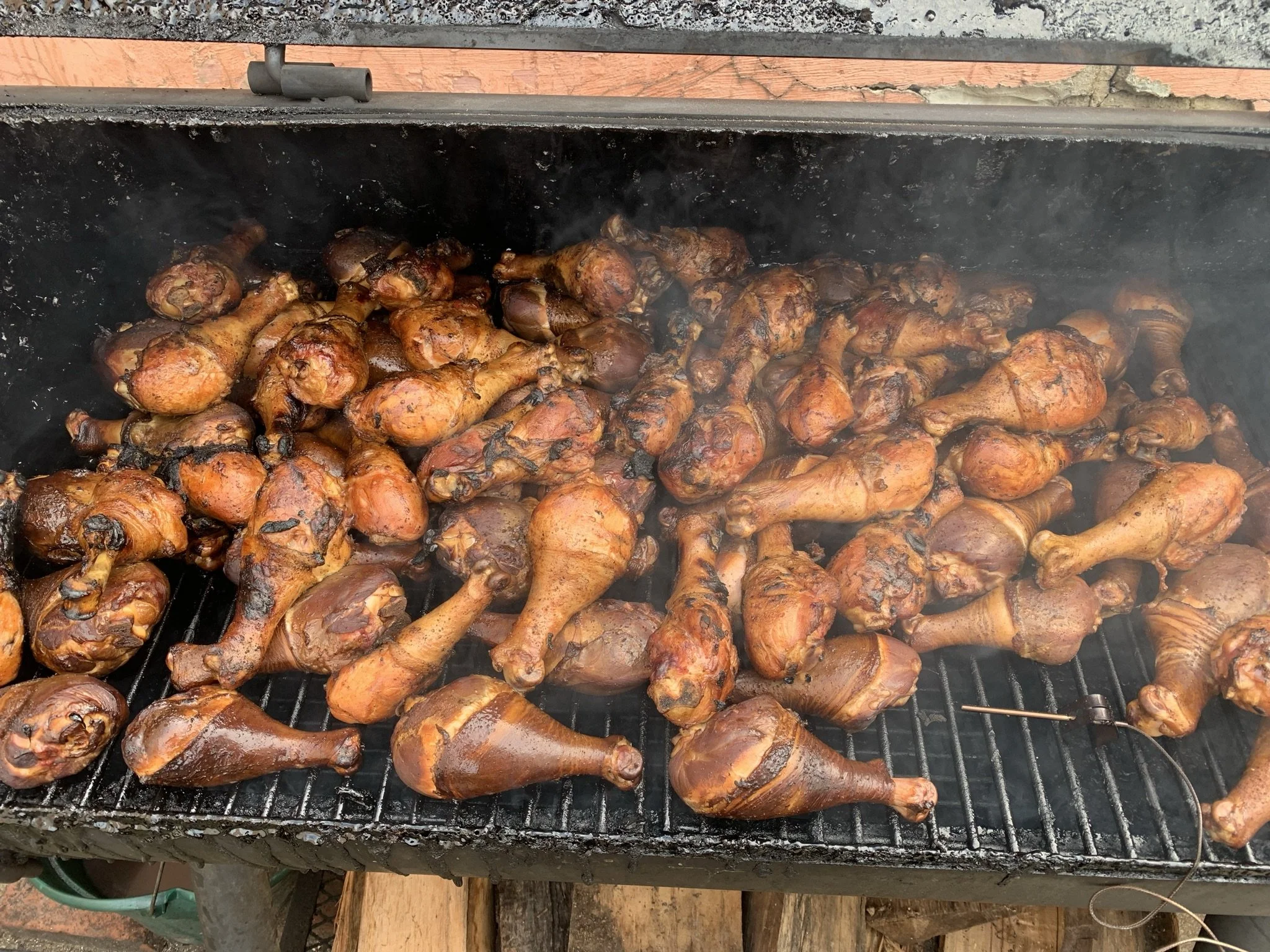 a picture of smoked chicken in a smoker