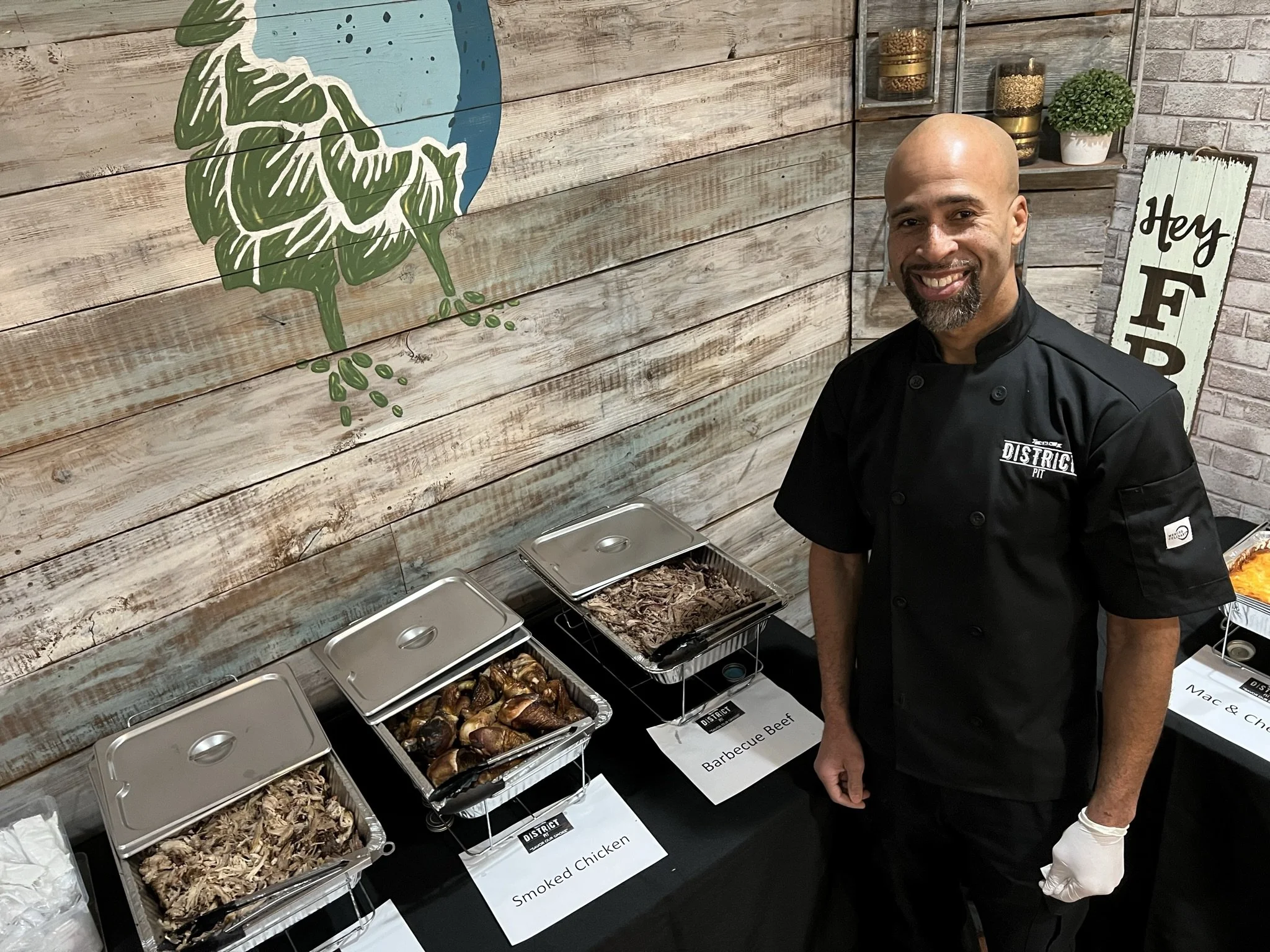 picture of roger next to food that is ready to serve
