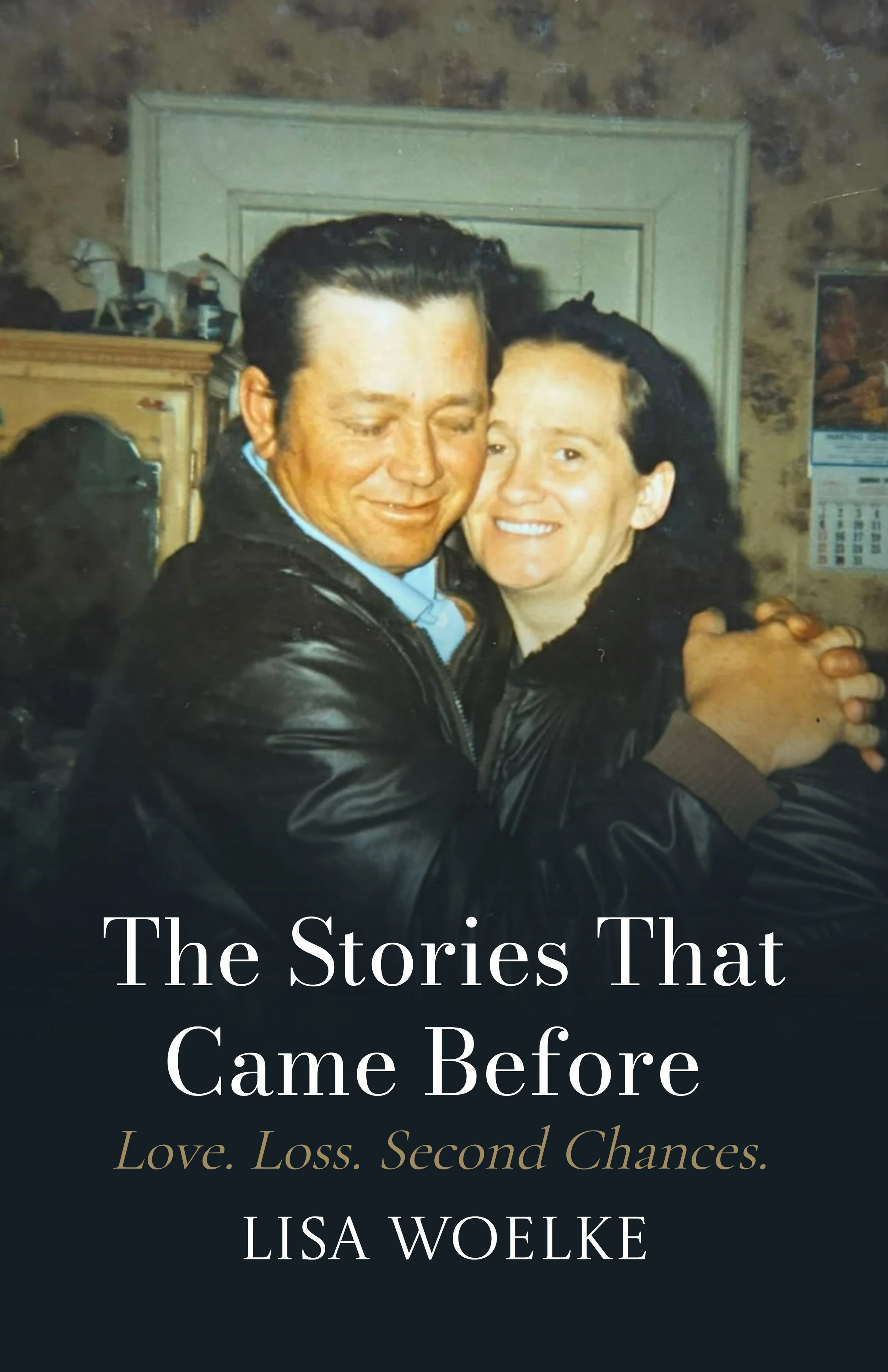 Cover of a book titled 'The Stories That Came Before' by Lisa Woelke, featuring a photo of a man and woman hugging and smiling.