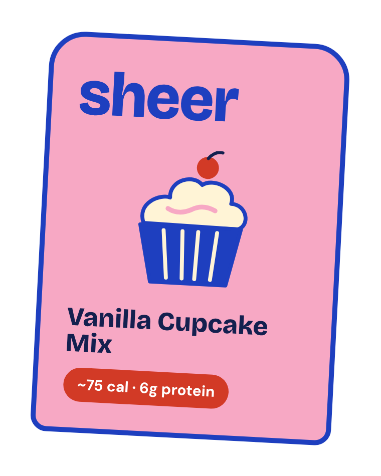 A pink label with a blue border advertising a vanilla cupcake mix, with an illustration of a cupcake with white frosting and a cherry on top, and text indicating approximately 75 calories and 6 grams of protein.