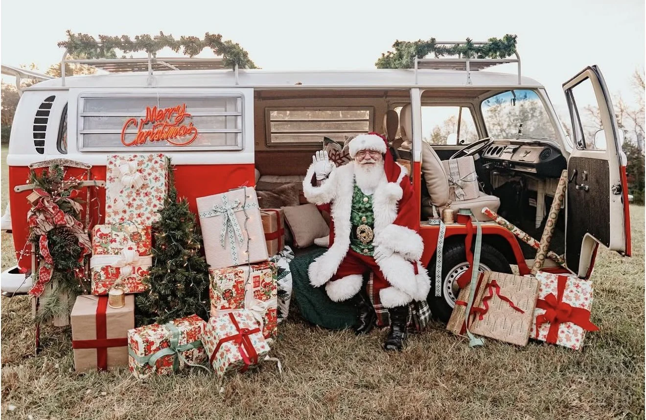 Santa Claus with Ruby, red 1970 VW bus decorated for Christmas, Knoxville TN