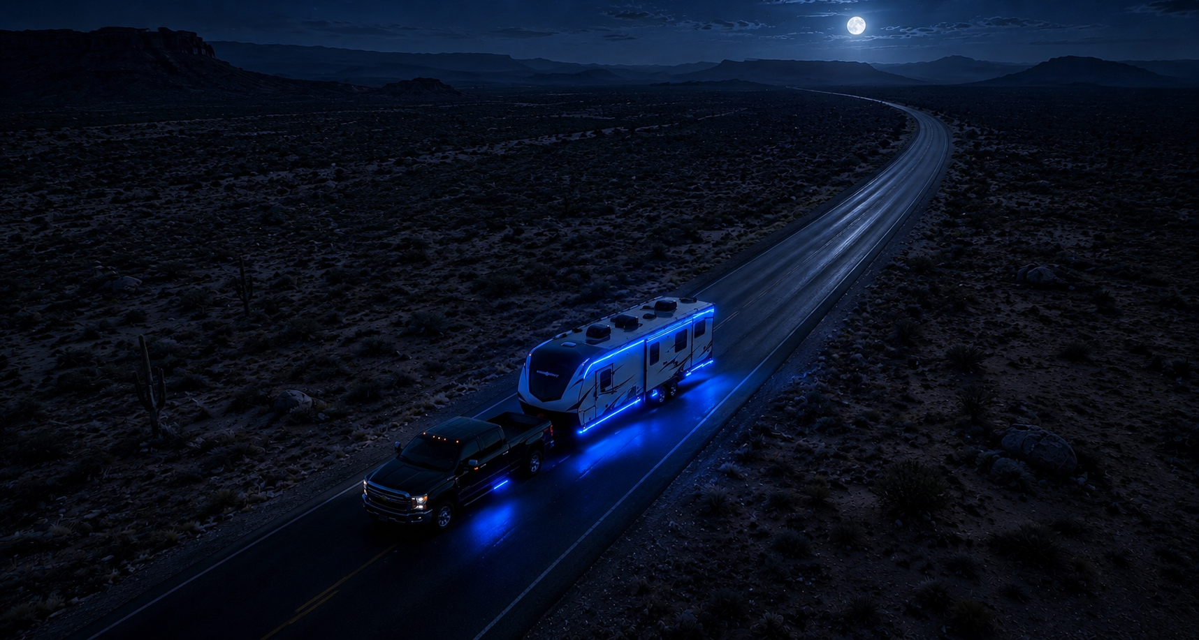 A nighttime scene of a black pickup truck towing a blue-lit RV on a deserted highway through a desert landscape under a full moon.