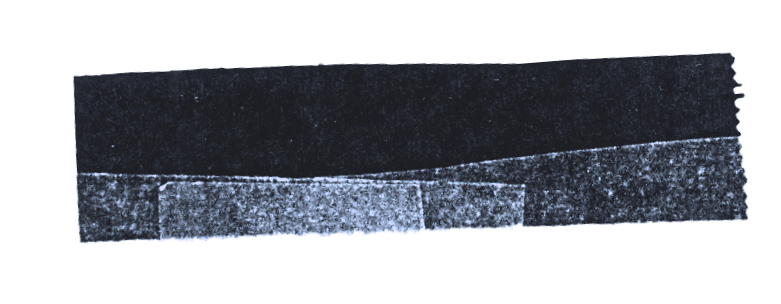 Close-up of a torn strip of black tape or material with frayed edges and slight curvature.