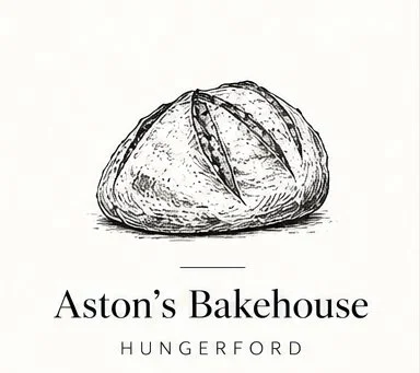 Black and white illustration of a round bread loaf with scoring on top, labeled "Aston's Bakehouse Hungerford."
