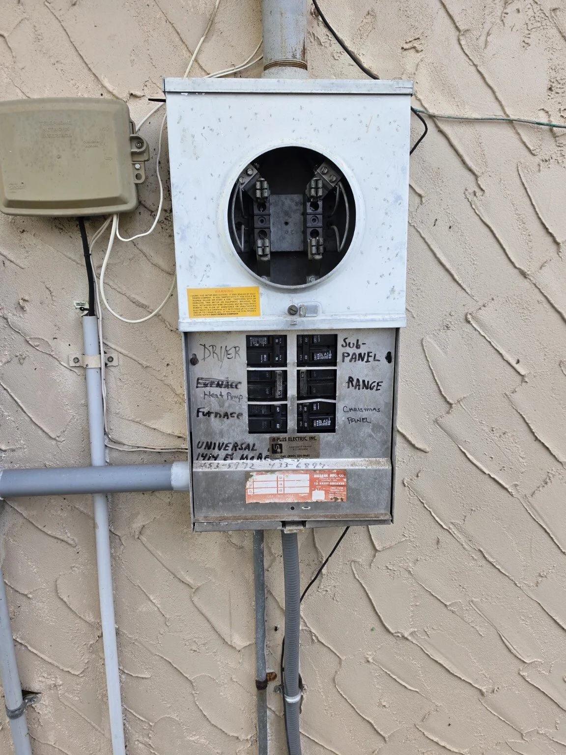 Exterior meter and panel project in progress; meter removed