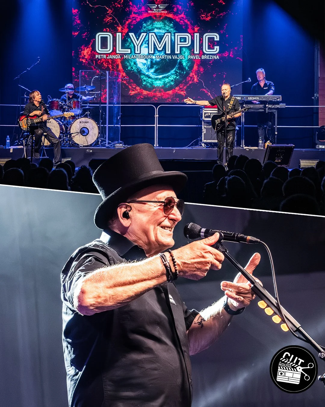 A live music performance on stage with a band, and an older man wearing a hat and sunglasses smiling and speaking into a microphone in the foreground.