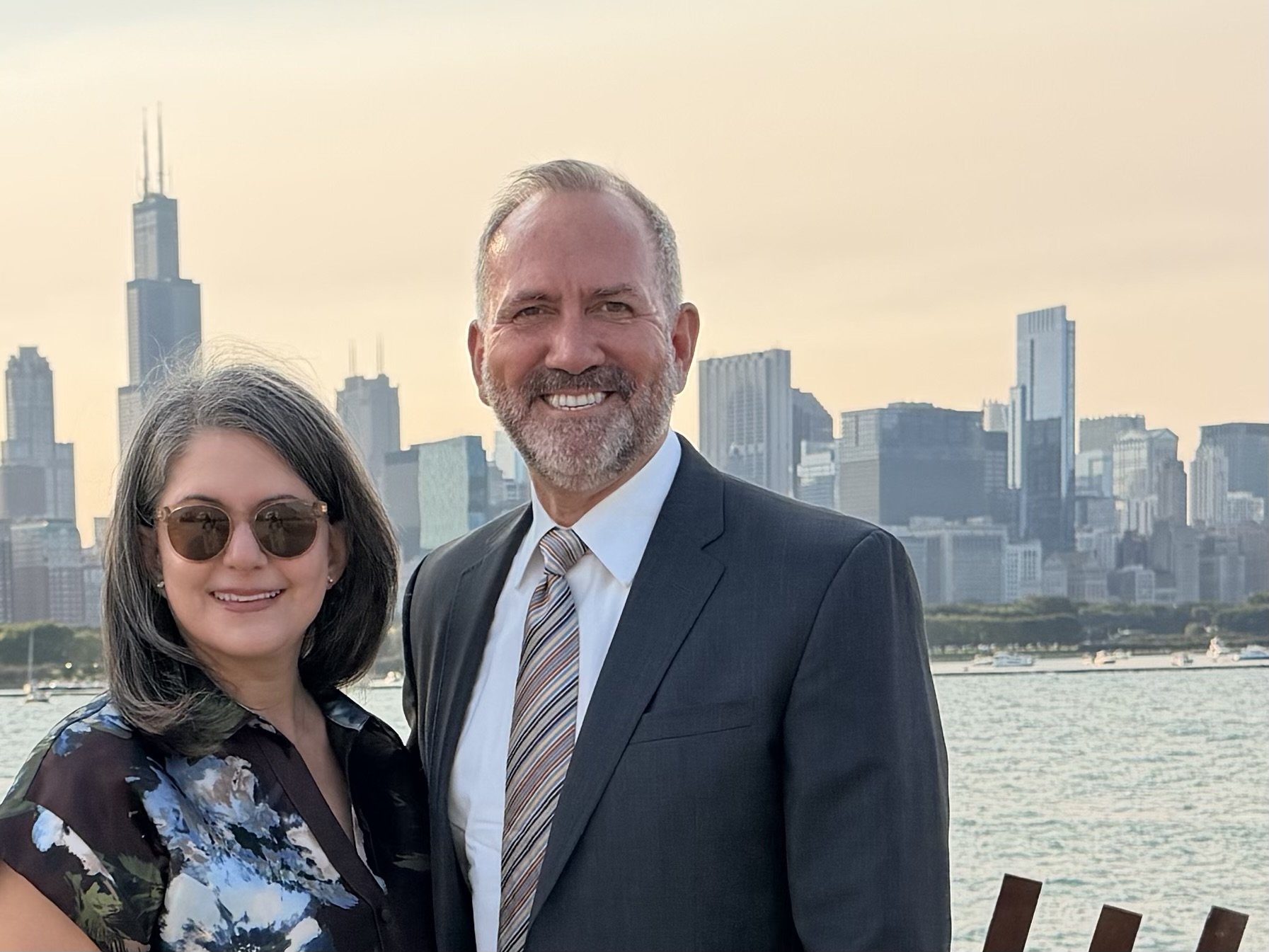 Two business partners with city in the skyline