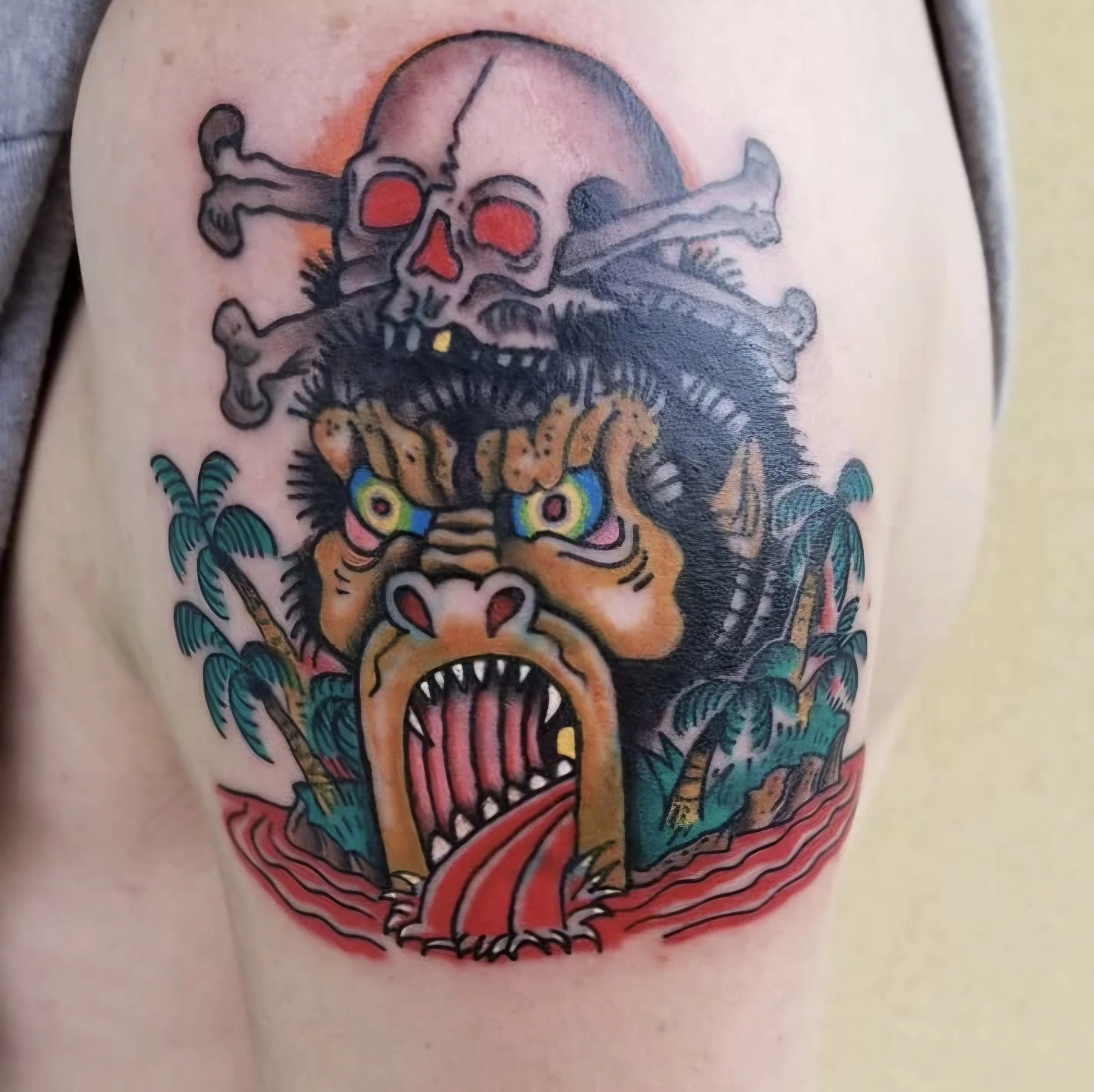 Bold traditional gorilla and skull tattoo by Martin at Apex Arts Collective in Beaufort, SC, completed as a walk-in.