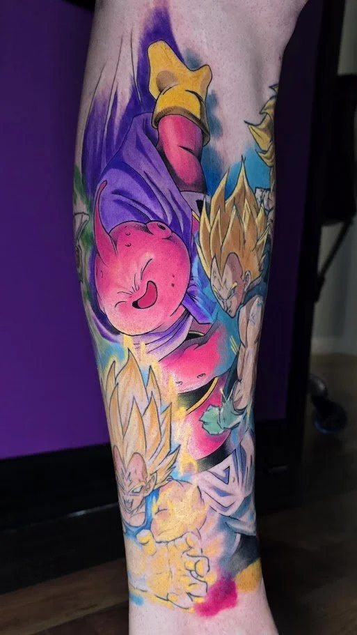 Vibrant Dragon Ball anime leg tattoo by Billy Smith at Apex Arts Collective, with saturated pink, purple, blue, and gold.