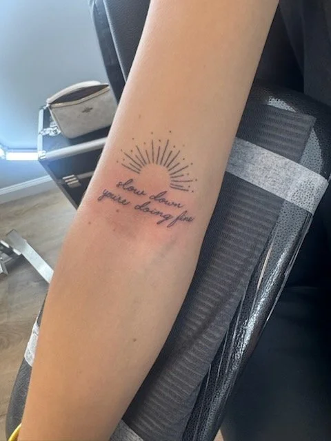 Fine-line sun and script · Walk-in by Martin