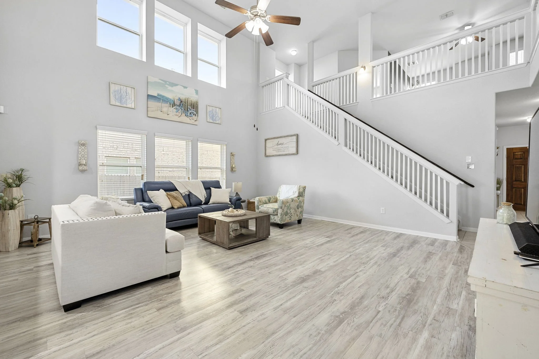Two story living room at 8935 Holland Park, a home for sale in Converse, TX