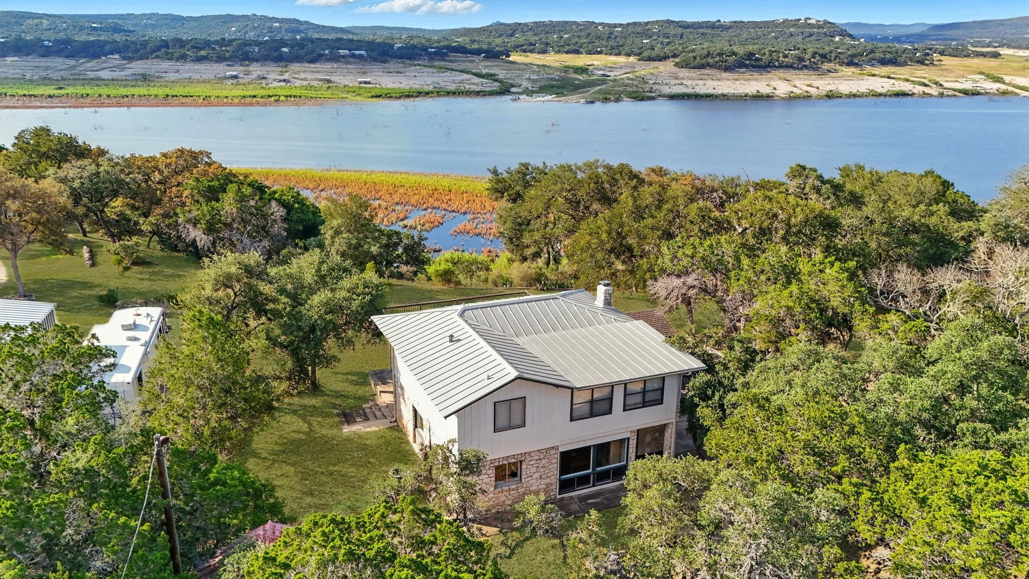 Aerial view of 550 County Road 262, a waterfront home with lake views in Mico, TX