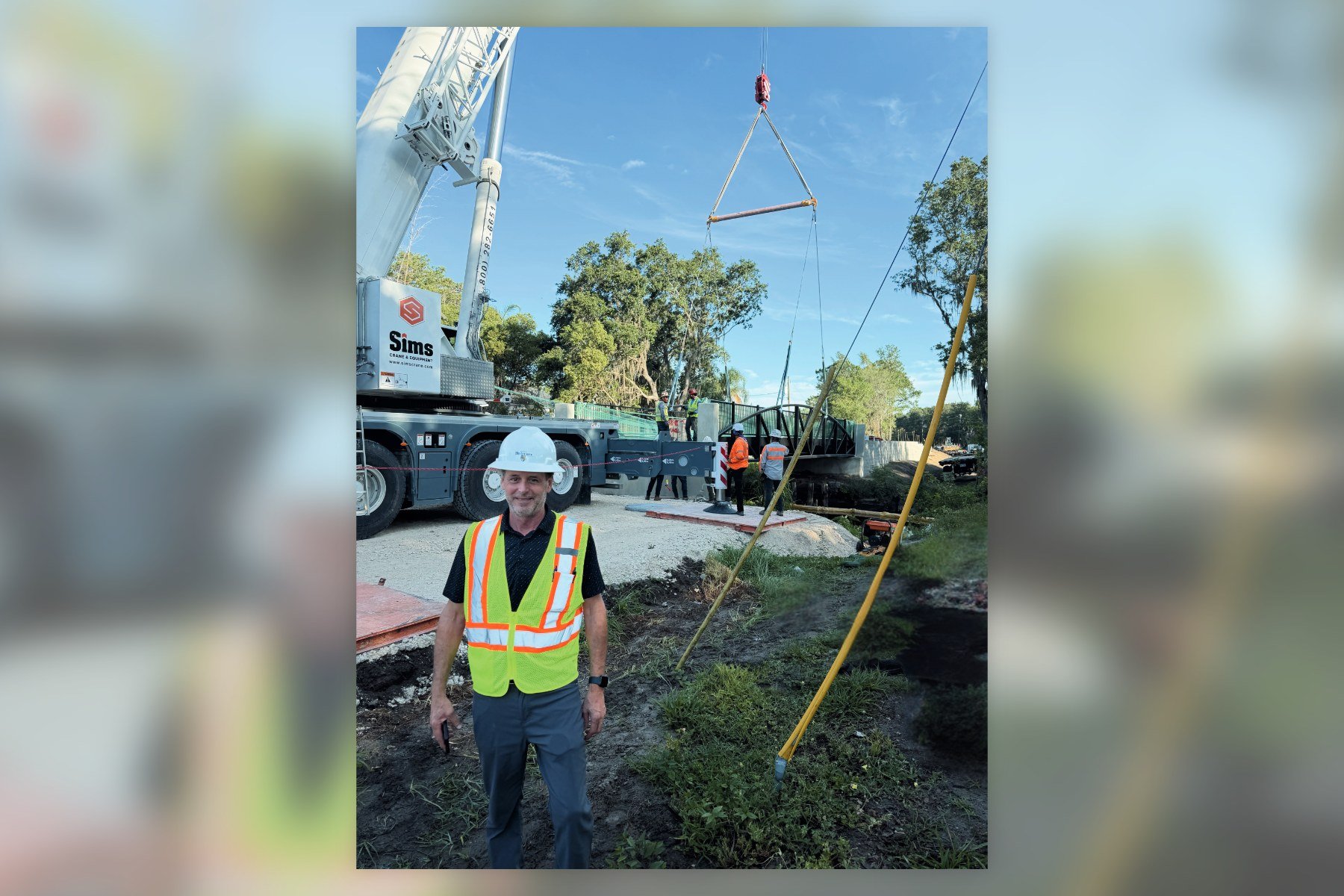 Town Consultant Engineer John Fitzgibbon in a hard hat during the Ward Trail bridge installation in Windermere